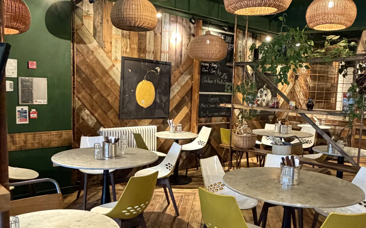 Luben dining room with a green ceiling and wicker pendants