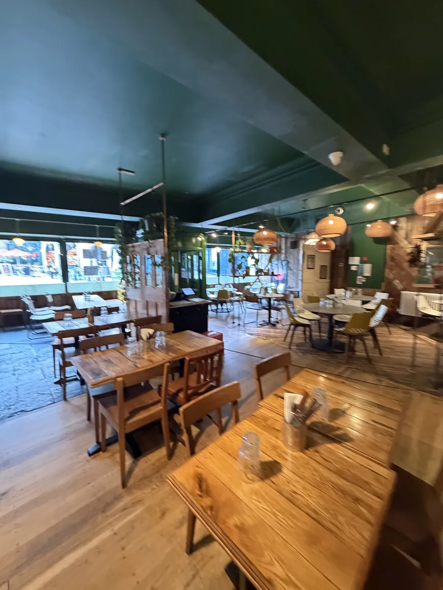 Wooden tables and banquette seating by Luben's front windows
