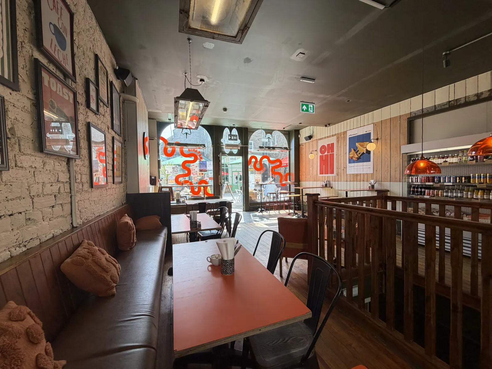 Panataria dining room with booths and a mural
